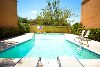 Ponderosa apartments pool area lounge chairs